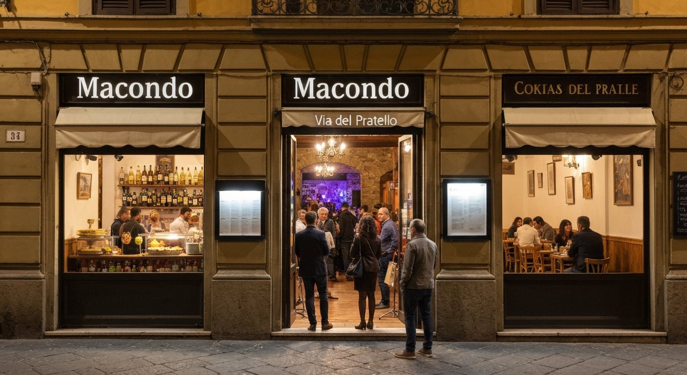 the front of Macondo on Via del Pratello at night, aperitivo buffet glowing inside while a small crowd leans in the doorway with live music spilling from the back room